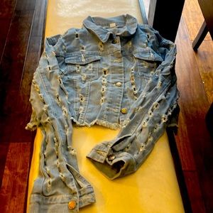 Denim crop Jean jacket with rips in it